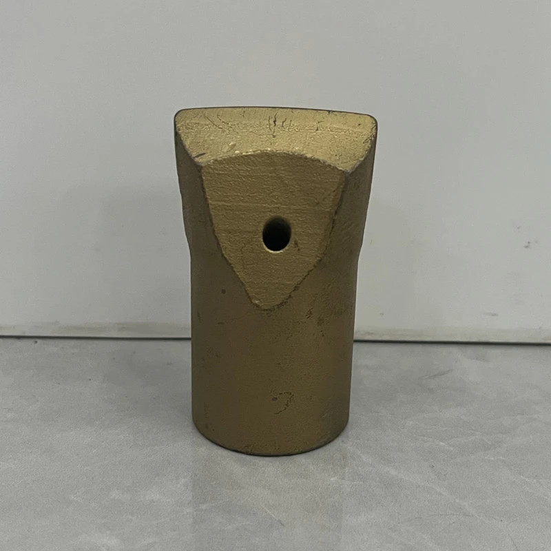 Tapered chisel rock drill bit face showing single tungsten carbide blade for percussive drilling Tapered chisel rock drill bit face showing single tungsten carbide blade for percussive drilling