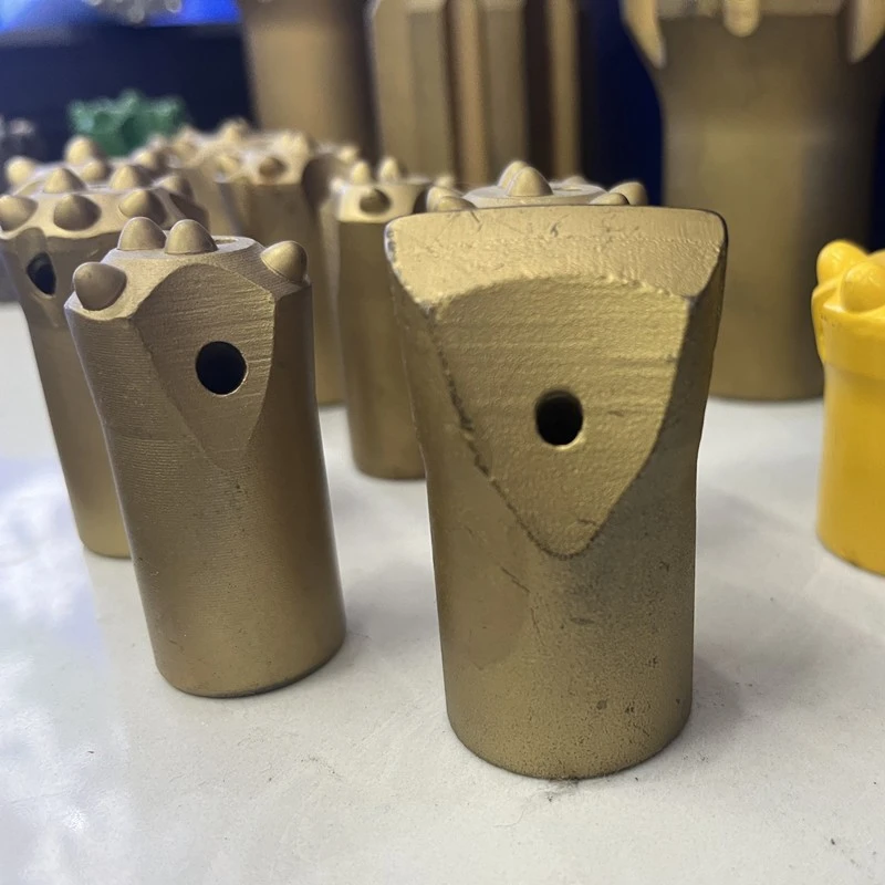 Tapered chisel drill bit and button bit side by side comparison for small hole rock drilling Tapered chisel drill bit and button bit side by side comparison for small hole rock drilling